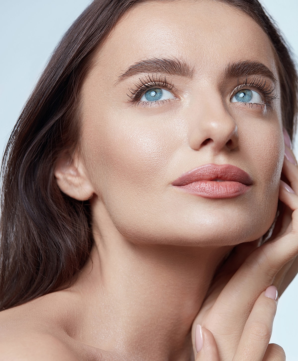 Portrait of a woman with striking blue eyes.
