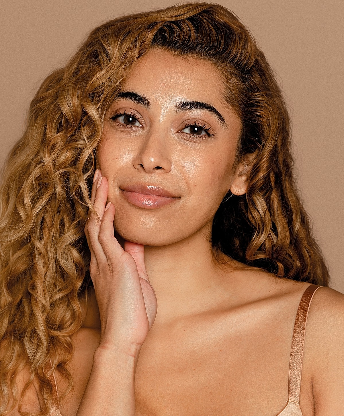 Portrait of a woman with curly hair.