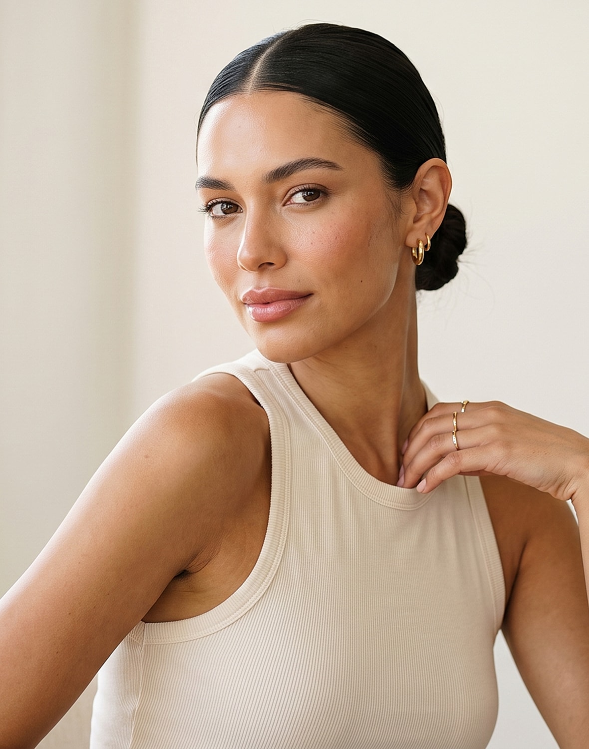 Woman with elegant hairstyle and natural makeup.