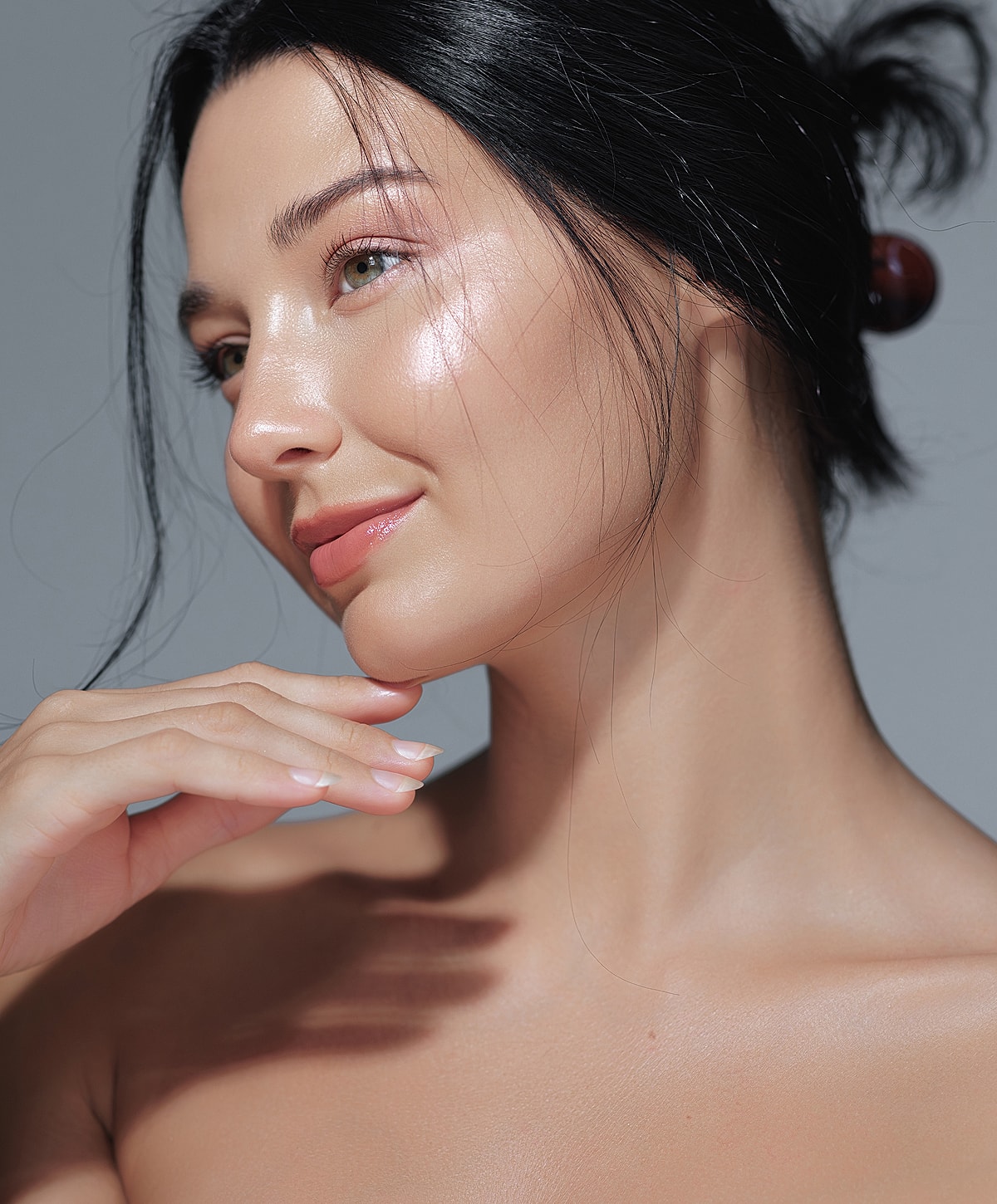 Portrait of a woman with glowing skin.