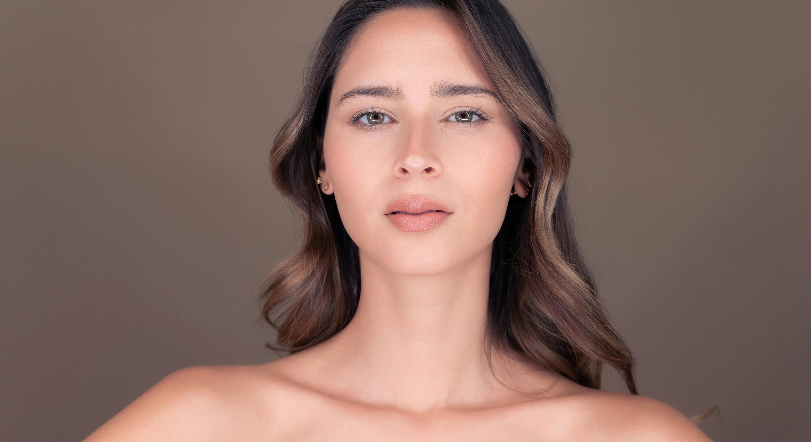 Woman with natural makeup and soft lighting.