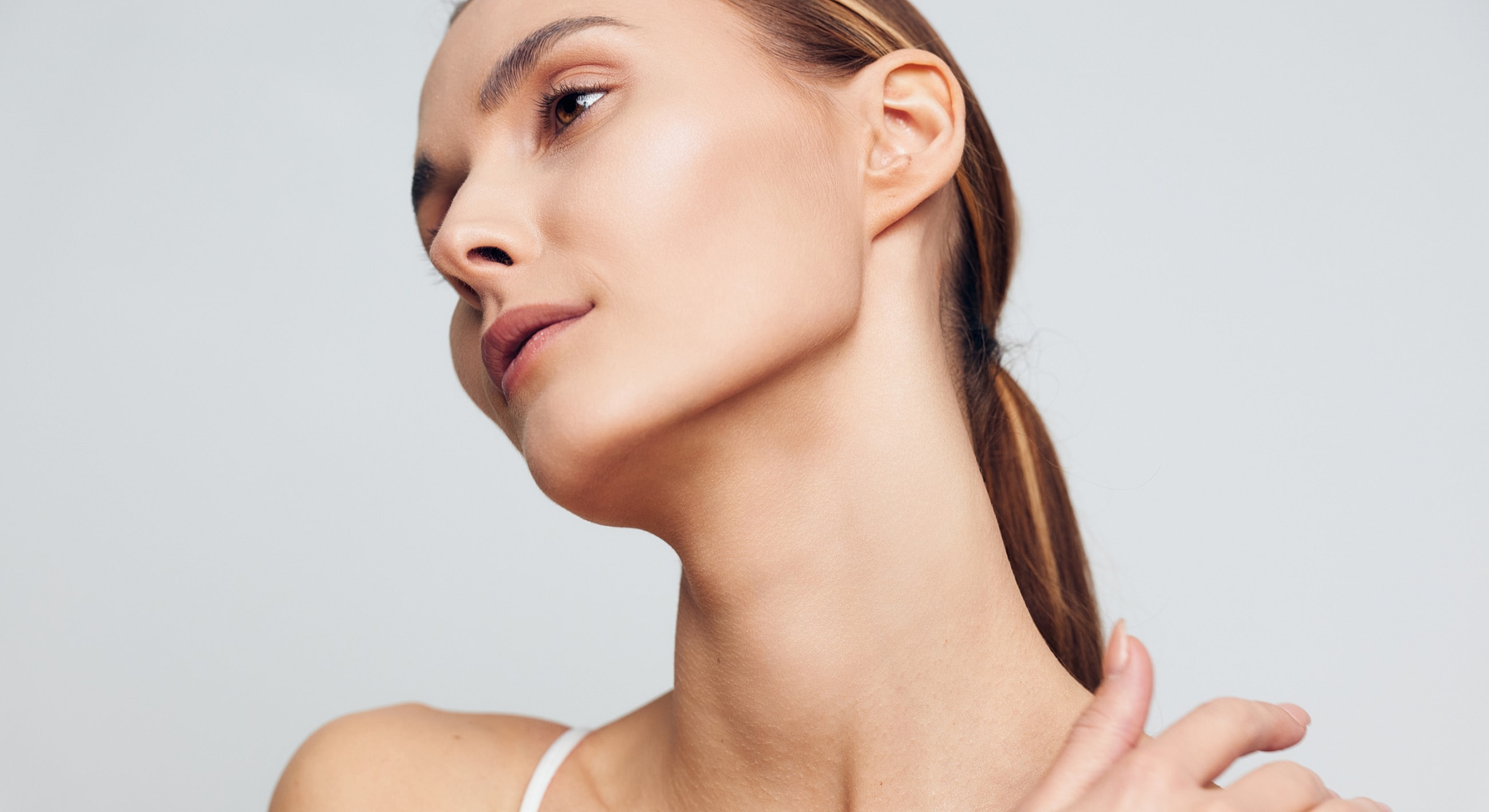 Profile of a woman showcasing graceful neck lines